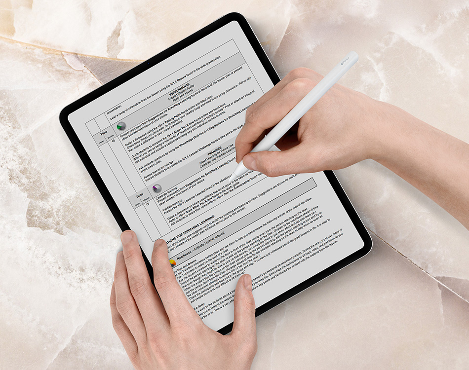 Pivot Point educator filling out curriculum support form on a tablet.