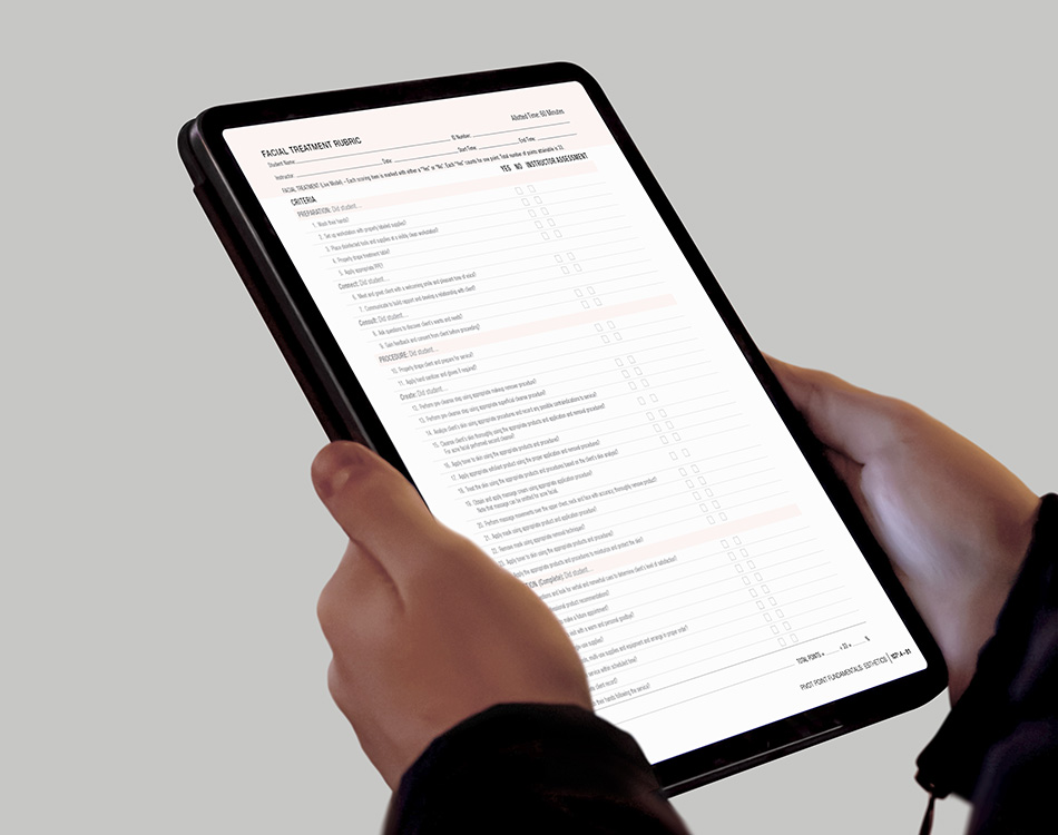Pivot Point educator filling out rubric form on a tablet.