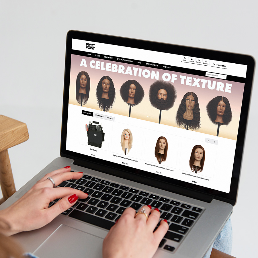 Woman checking Pivot Point Web Store with laptop