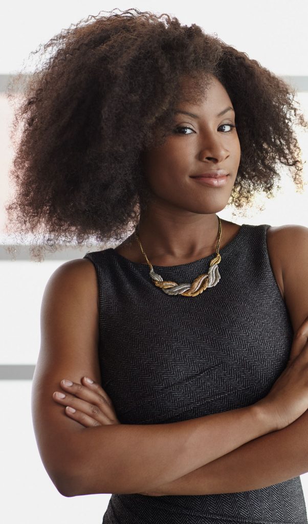 Friendly african american executive business woman brainstorming using green adhesive notes in a modern white office