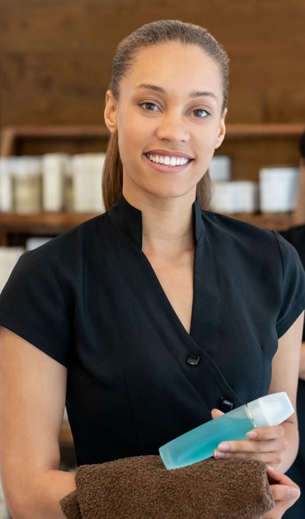 Portrait of a group of women working at a spa and looking at the camera smiling - beauty concepts