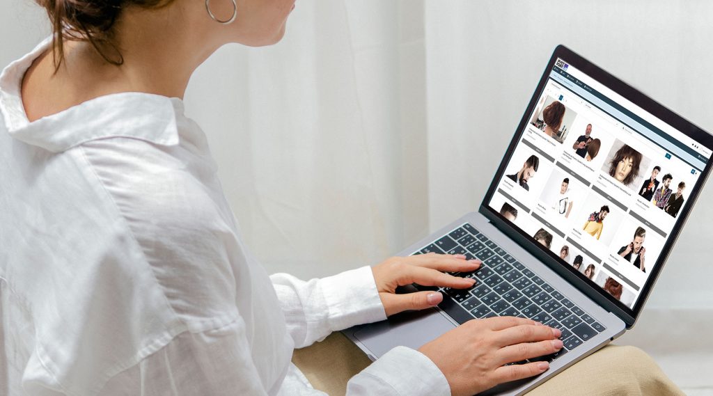 Woman using a laptop on a bean bag