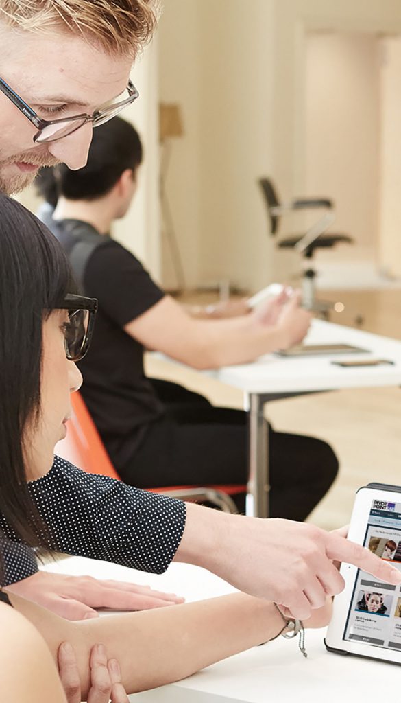 Pivot Point instructor and student reviewing LAB on a tablet